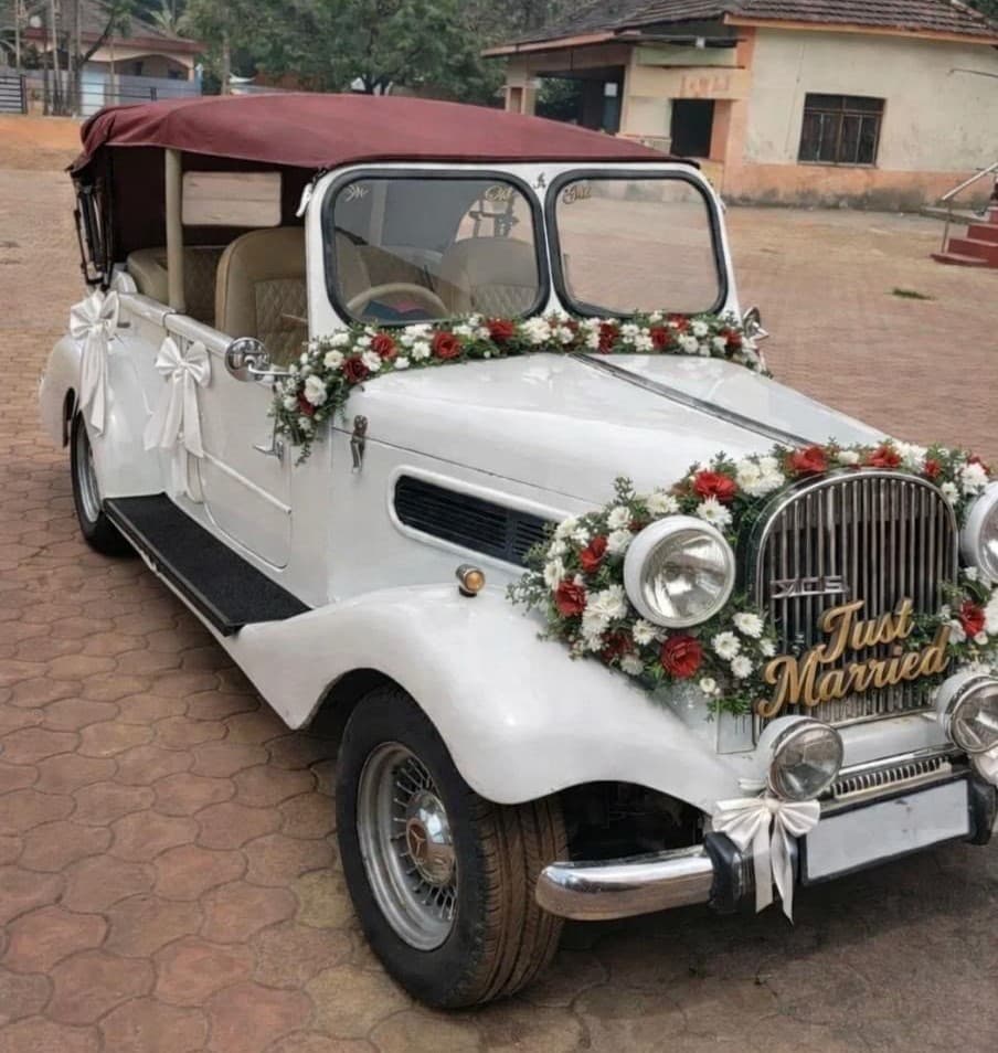 White Vintage Wedding Car with Floral Garlands in Goa